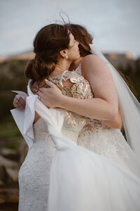 brides embracing