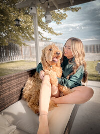 Kelsey and her dog outside the My Beloved Floral studio in Idaho