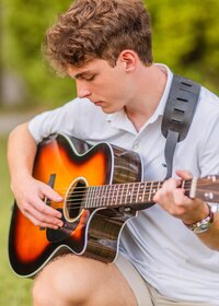 Senior Playing Guitar