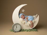 Beautiful newborn in a little blue blanket