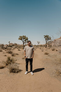 man standing on hiking path