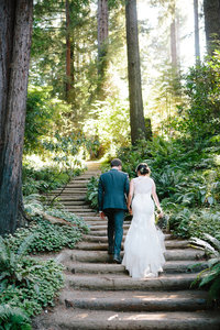 Couple walking up chapel stairs atNestldown in Redwoods