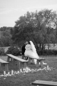 Silhouette of couple kissing against colorful sunset at wedding in cincinnati
