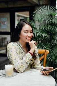 Woman smiling holding phone