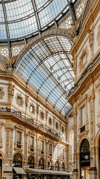 Historic Milan gallery arcade linking to travel maps and timezone resources. Tailored Oasis Travel Co.
