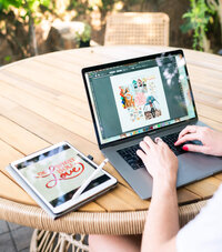 Micaela Nauman of Create & Wander working at a desk