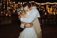 bride & groom hugging