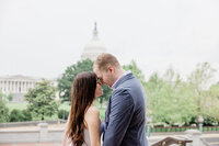 couple engagement running through dc streets