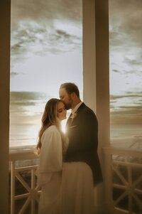 Editorial wedding dress hanging in moodyvenue window, cinematic film style