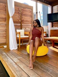 woman sitting by pool