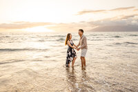 Maui Elopement Photographer captures couple playing in water after small beach wedding