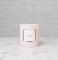 pink candle on a marble countertop