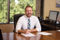 Natural headshot of lawyer at his desk