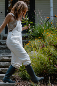 Sam walking in her garden of wildflowers