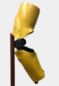 Custom rodeo elbow brace in gold color.