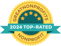 A gold seal containing the words "Great Nonprofits 2024 Top-Rated Nonprofit" in blue print.