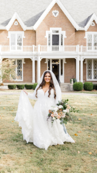Bride in front of Warrenwood Manor, a wedding venue in danville, ky