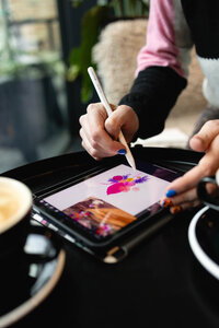 Emma, an Ireland wedding planner & stylist, designing a wedding on her iPad