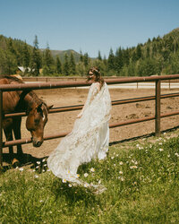 bride with horse near gate