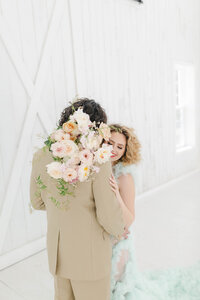 happy couple with bouquet of flowers