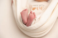 Close-up image of an infant's feet and toes.