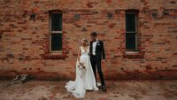 bride and groom having portraits at their Pericoota station wedding