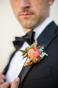 Close up of Grooms boutonniere