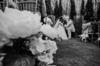 couple stands at san diego wedding alter