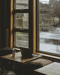 Computer on a coffee shop table