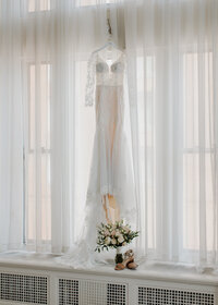 Dress hangs before bride gets ready for her Duluth, Minnesota wedding