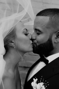 Bride and groom share a romantic kiss during their San Antonio wedding day.