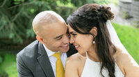 bride and groom smiling and close to eachother in worthington mn