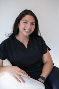 Photo of Dominique Pocchia, RN, Registered Nurse at Refined Medical NY in East Setauket Long Island, providing patient care and IV vitamin therapy services.