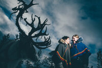 A couple poses with their reindeer right after their wedding in the Swedish Arctic