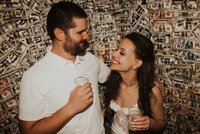 Couple in front of Le Meridien Tampa popping champagne after exchanging vows for their Tampa elopement