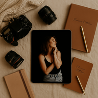 Flat lay of a creative workspace with a tablet showcasing Shannon Kathleen, an expert in self-portrait photography, surrounded by photography tools and neutral-toned accessories in a cozy and inspiring setting.