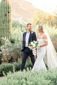 El Chorro Scottsdale Event Lawn Path With Bride and Groom walking and laughing