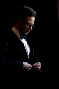 groom getting ready in tuxedo