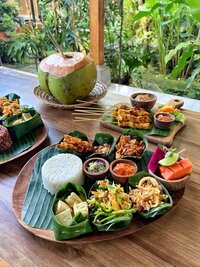 A hand writing in a journal.