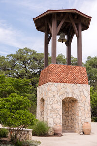 The bell at Camp Lucy, one of Austin’s best wedding venues.