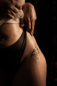 a tattoo being shown off for boudoir