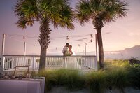 Sarasota-Bradenton Wedding Photography of bride and groom kissing on the beach at sunset
