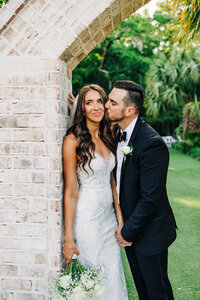 Couple kissing at the altar