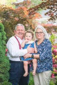 parents with young boy giggling