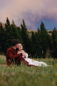 Wedding and Elopement Photography, bride and groom snuggle on picnic blanket during Colorado elopement.
