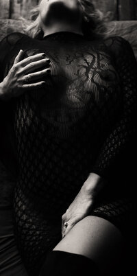 Close-up of woman in lace during a stylized boudoir session
