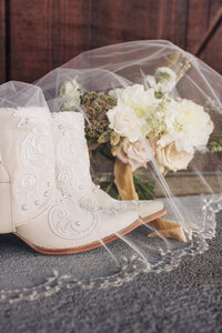 Bridal cowboy boots and wedding florals