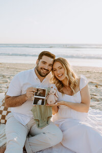 San Diego Natural Candid Documentary Family Maternity Baby Pregnancy Announcement Photo shoot at La Jolla beach pier - San Diego Family Photographer
