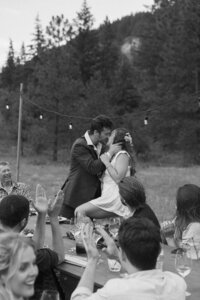 Adventurous bride and groom kiss at festival style wedding in Washington