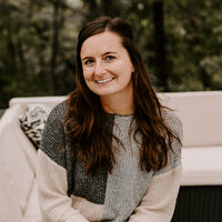 A professional headshot of Jordin Brinn, owner of Unica Formo, the website design agency known for creating beautiful, functional websites.